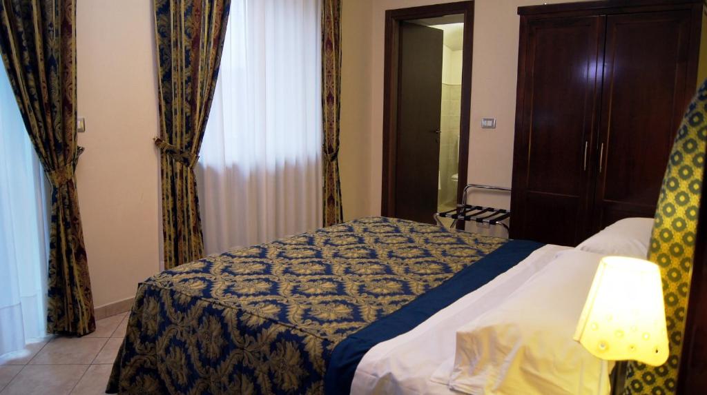 Postel nebo postele na pokoji v ubytování Hotel e trattoria San Giorgio
