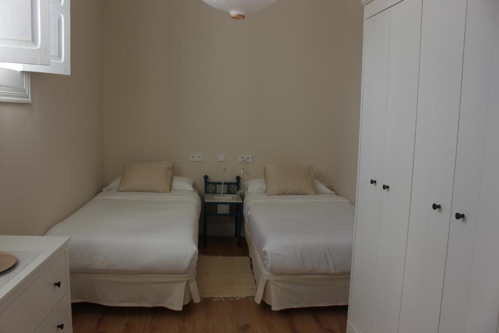 Postel nebo postele na pokoji v ubytování La Casona de Galdós