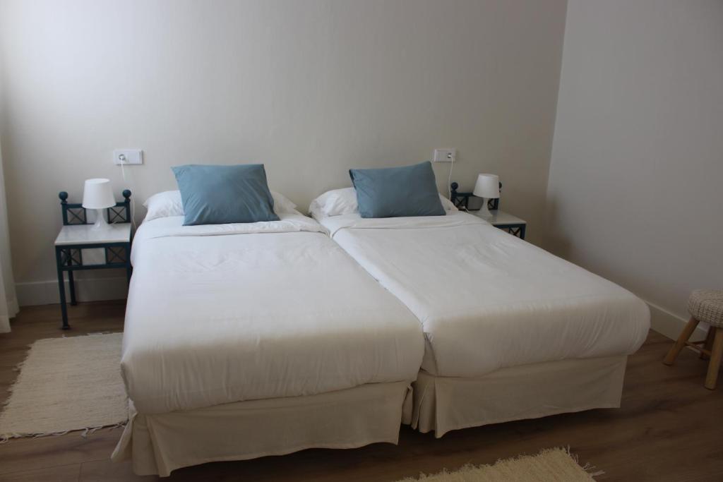Postel nebo postele na pokoji v ubytování La Casona de Galdós