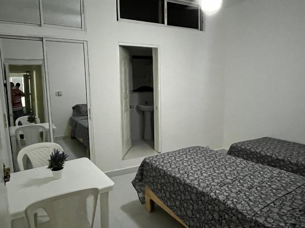 Postel nebo postele na pokoji v ubytování Residencia 105