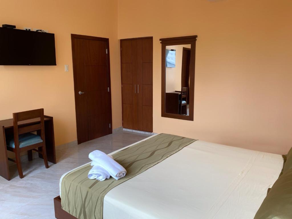 Postel nebo postele na pokoji v ubytování Hostal California Inn