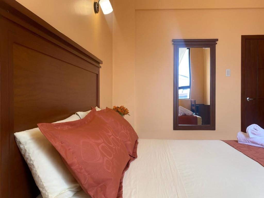 Postel nebo postele na pokoji v ubytování Hostal California Inn