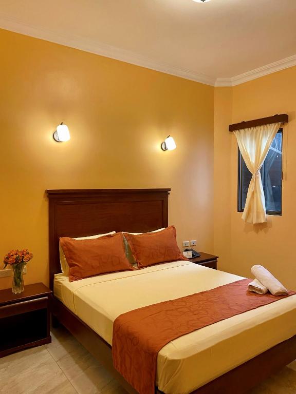 Postel nebo postele na pokoji v ubytování Hostal California Inn
