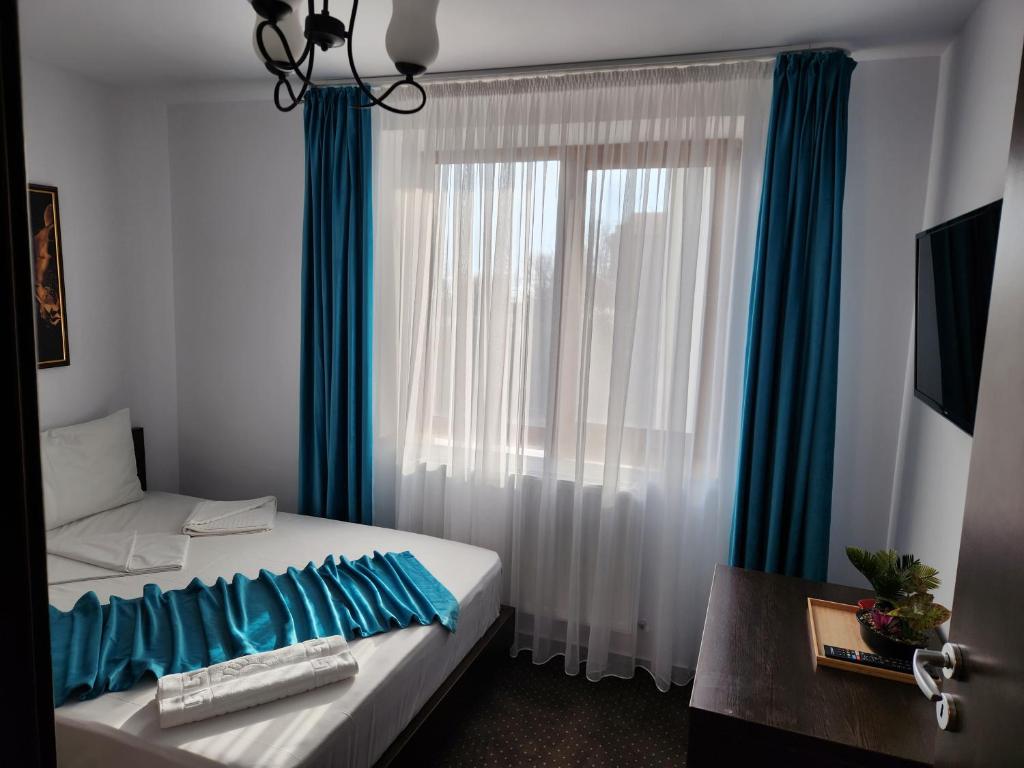 Postel nebo postele na pokoji v ubytování Turquoise Konak