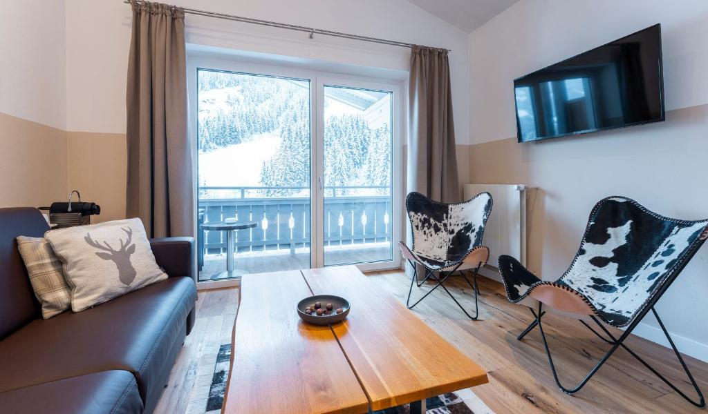 Televiisor ja/või meelelahutuskeskus majutusasutuses Hotel Residenz Hochalm - Joker Card Partner