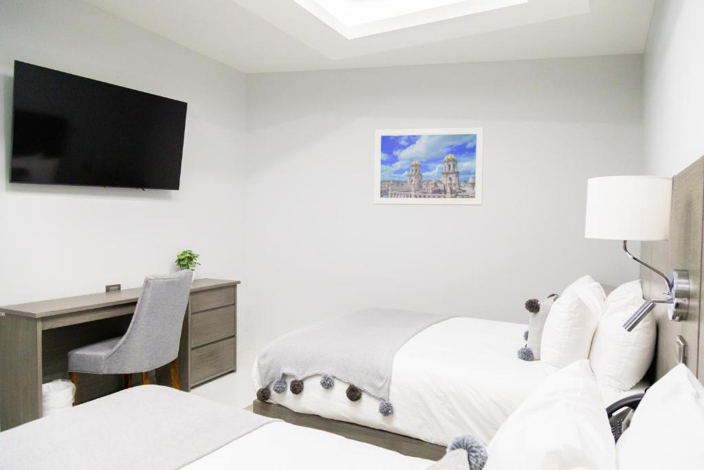 TV a/nebo společenská místnost v ubytování Hotel GRALTA