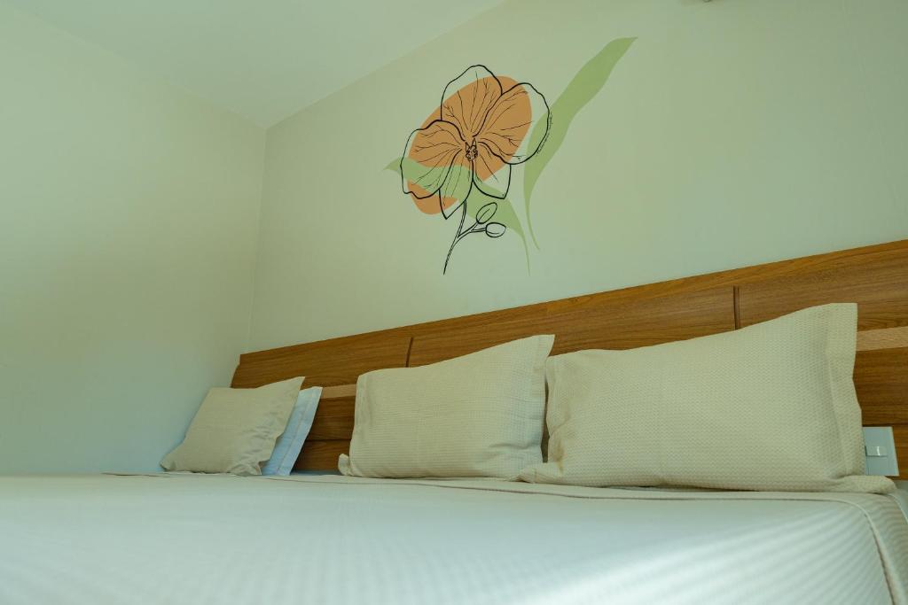 Postel nebo postele na pokoji v ubytování Orquídeas Praia Hotel