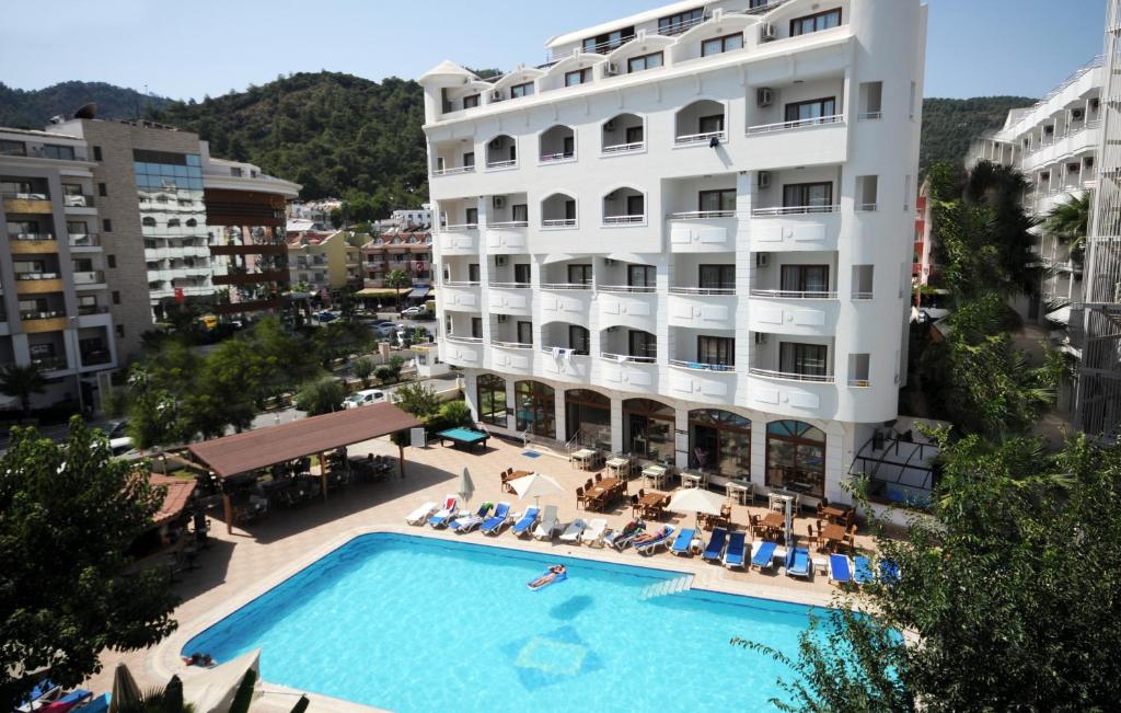 a hotel with a swimming pool in front of a building at My Dream Hotel in Marmaris