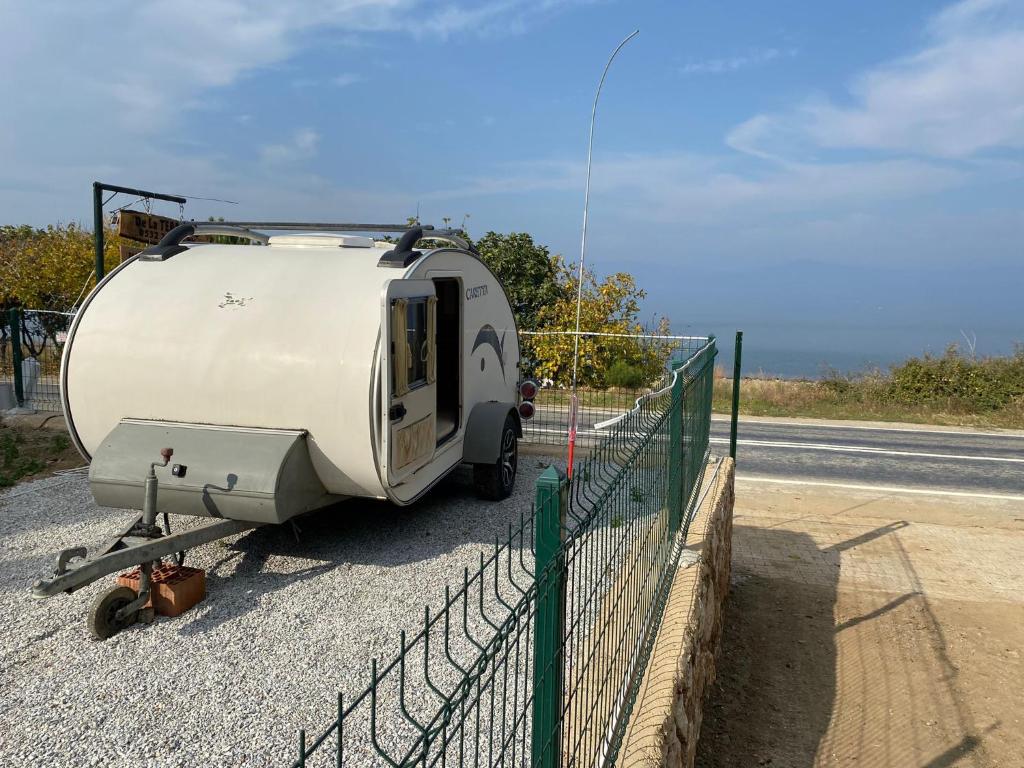 a white trailer parked on the side of a road at De La Terrasse IZNIK in İznik