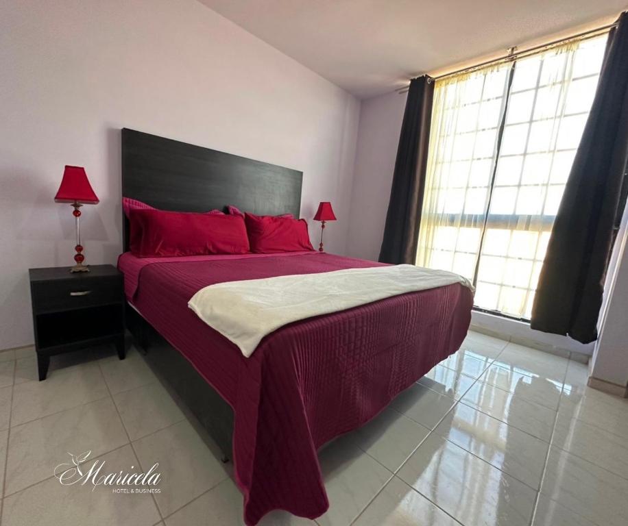 Postel nebo postele na pokoji v ubytování Hotel Maricela