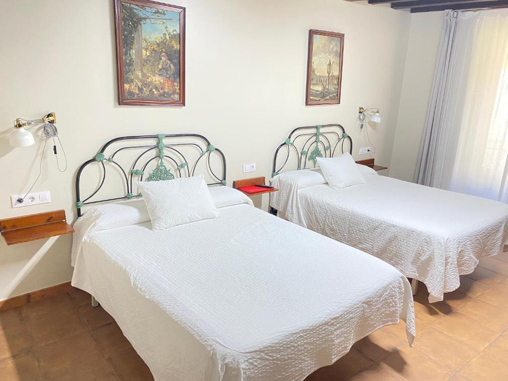 Postel nebo postele na pokoji v ubytování Casa Sara