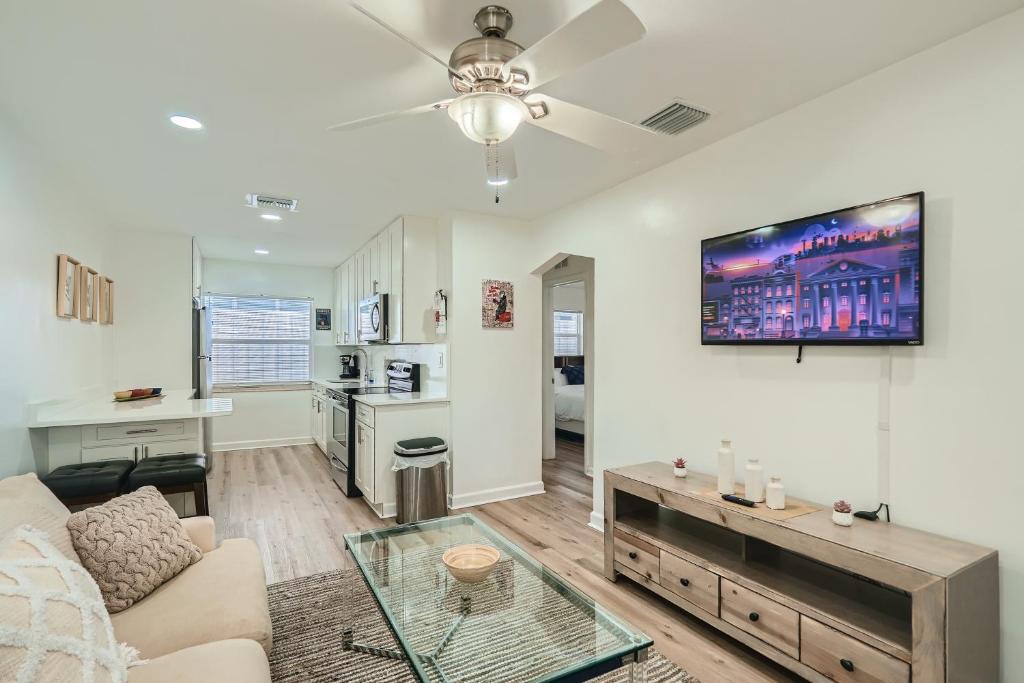 a living room with a couch and a table at Hidden Oasis ** Stunning 2 BR ** Sunset Shores in West Palm Beach