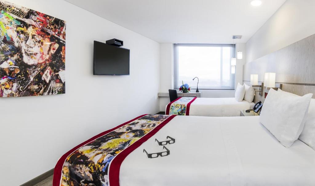 Postel nebo postele na pokoji v ubytování Hotel Black Tower Premium