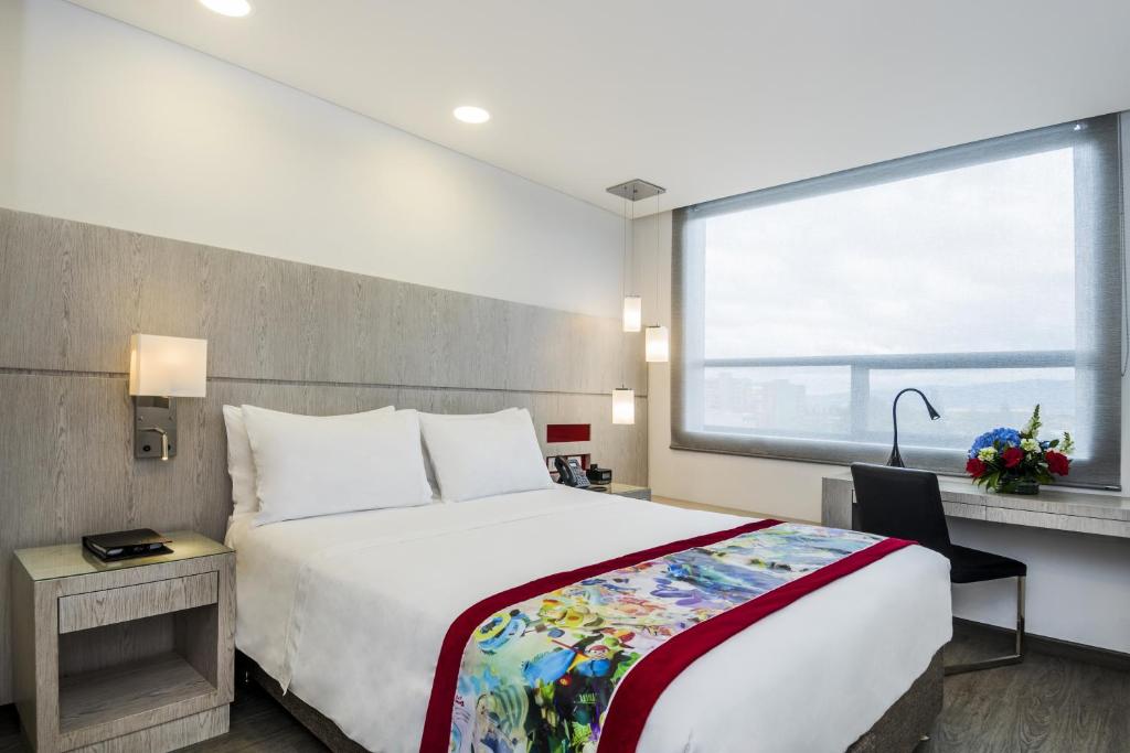 Postel nebo postele na pokoji v ubytování Hotel Black Tower Premium
