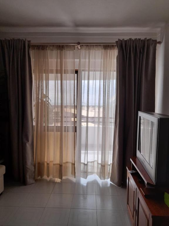 TV a/nebo společenská místnost v ubytování Apartamento Sunshine 601-Vilamoura