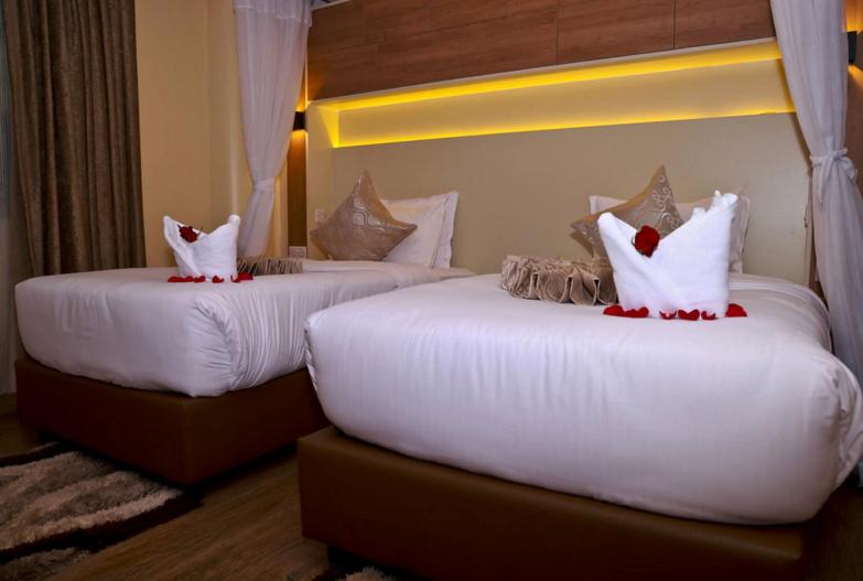 Postel nebo postele na pokoji v ubytování Hylise Hotel