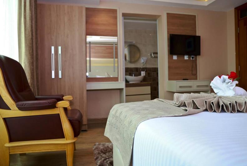 Postel nebo postele na pokoji v ubytování Hylise Hotel