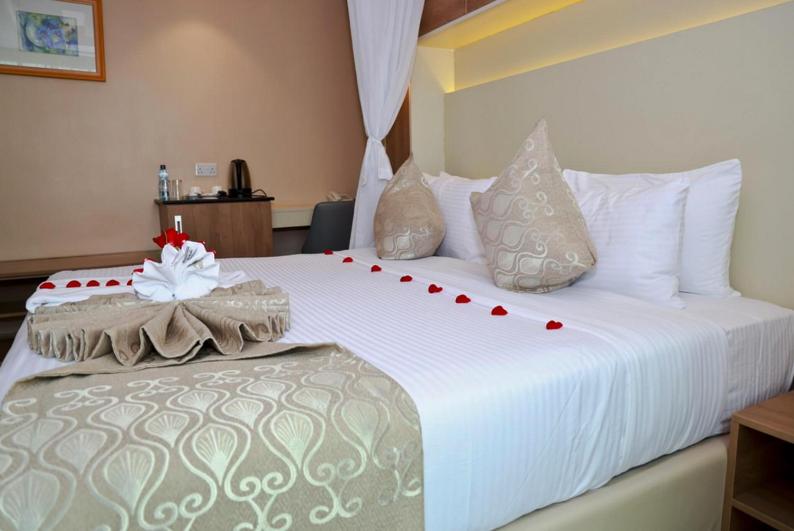 Postel nebo postele na pokoji v ubytování Hylise Hotel