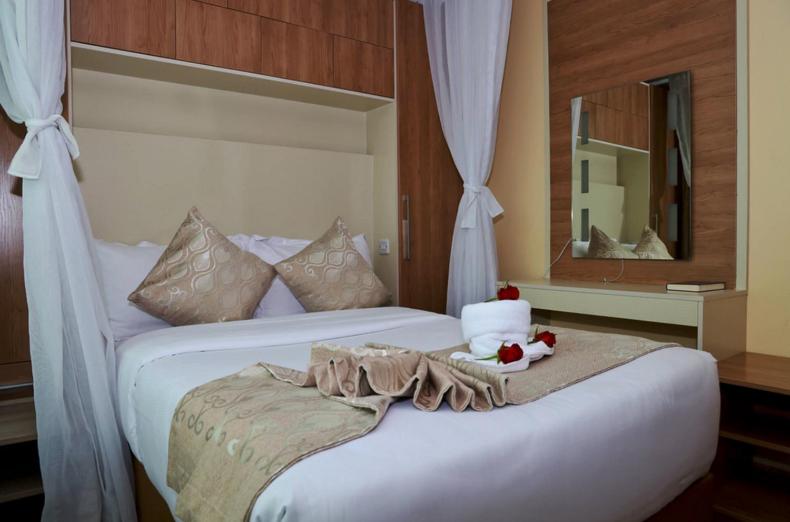 Postel nebo postele na pokoji v ubytování Hylise Hotel