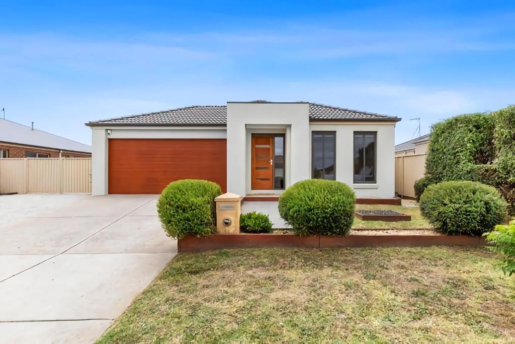 a house with a driveway and a garage at Chifley Place - Cool Suburban Crib! in Sebastopol