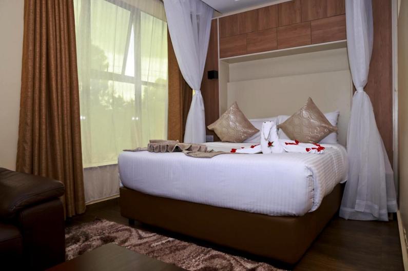 Postel nebo postele na pokoji v ubytování Hylise Hotel