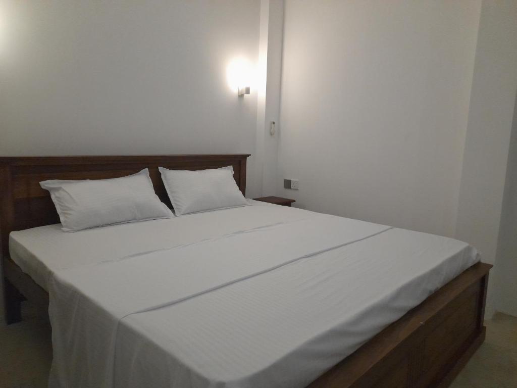 Postel nebo postele na pokoji v ubytování Gloria Inn