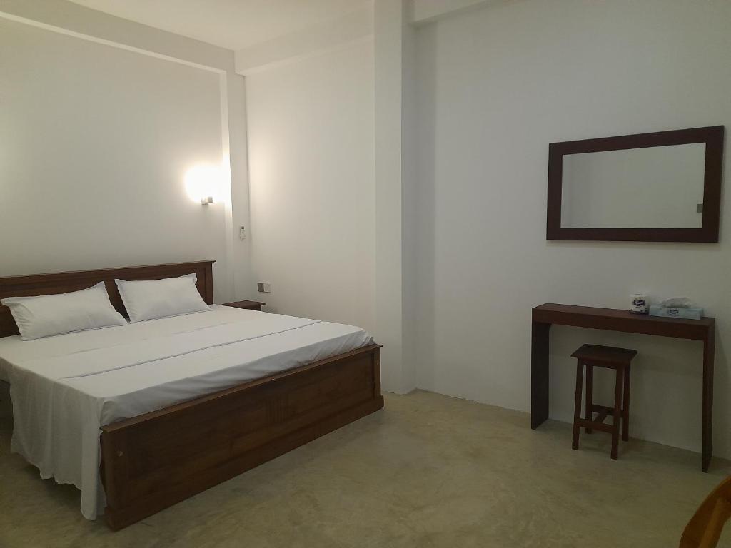 Postel nebo postele na pokoji v ubytování Gloria Inn