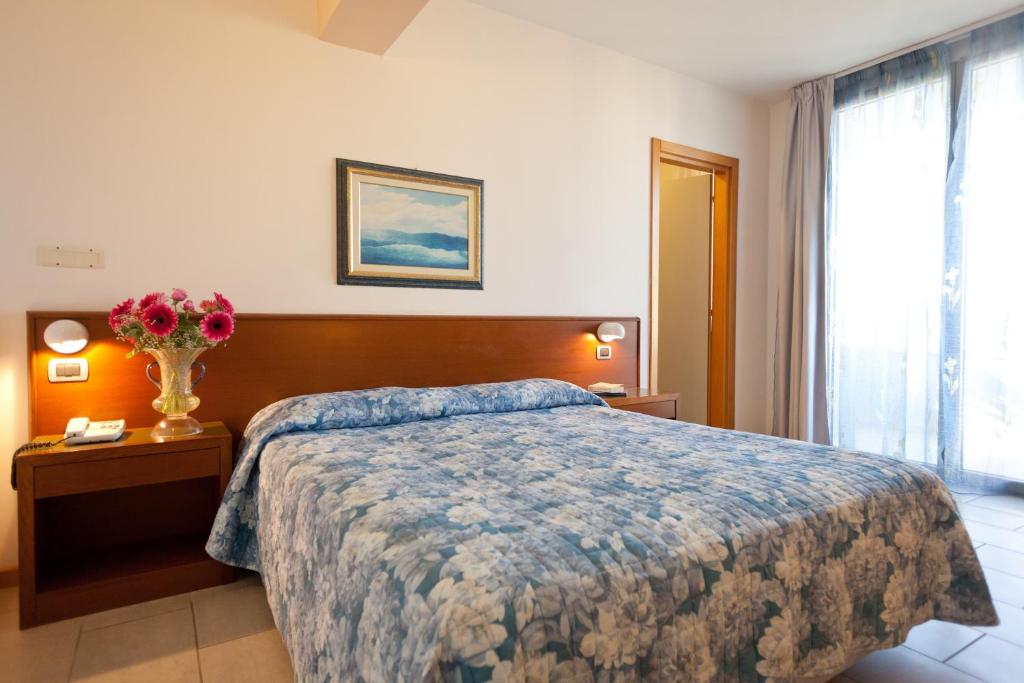 Postel nebo postele na pokoji v ubytování Hotel Idania