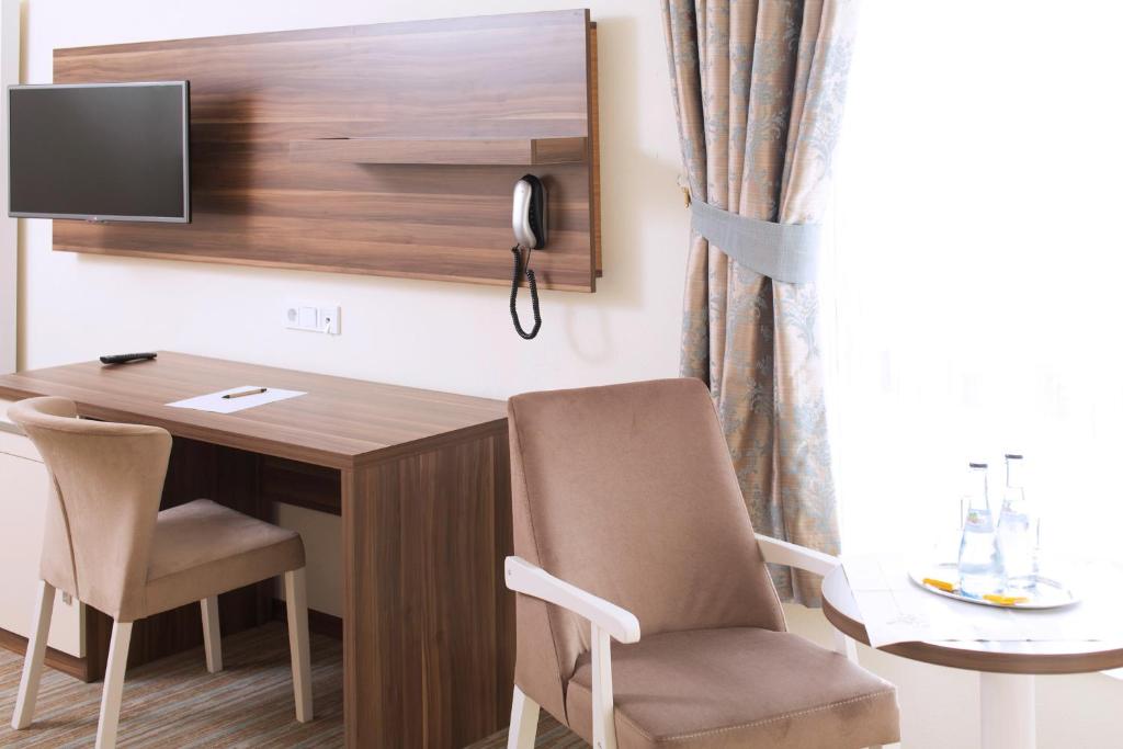 TV a/nebo společenská místnost v ubytování CityHotel am McKeePlatz