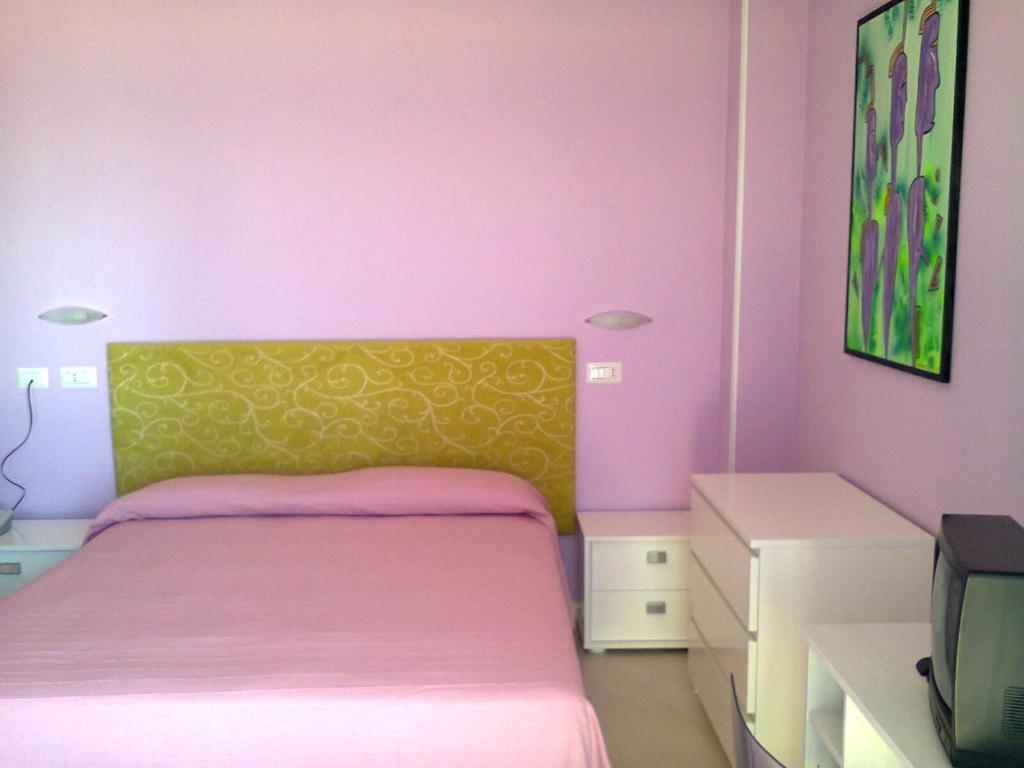 Postel nebo postele na pokoji v ubytování Hotel Flaminio