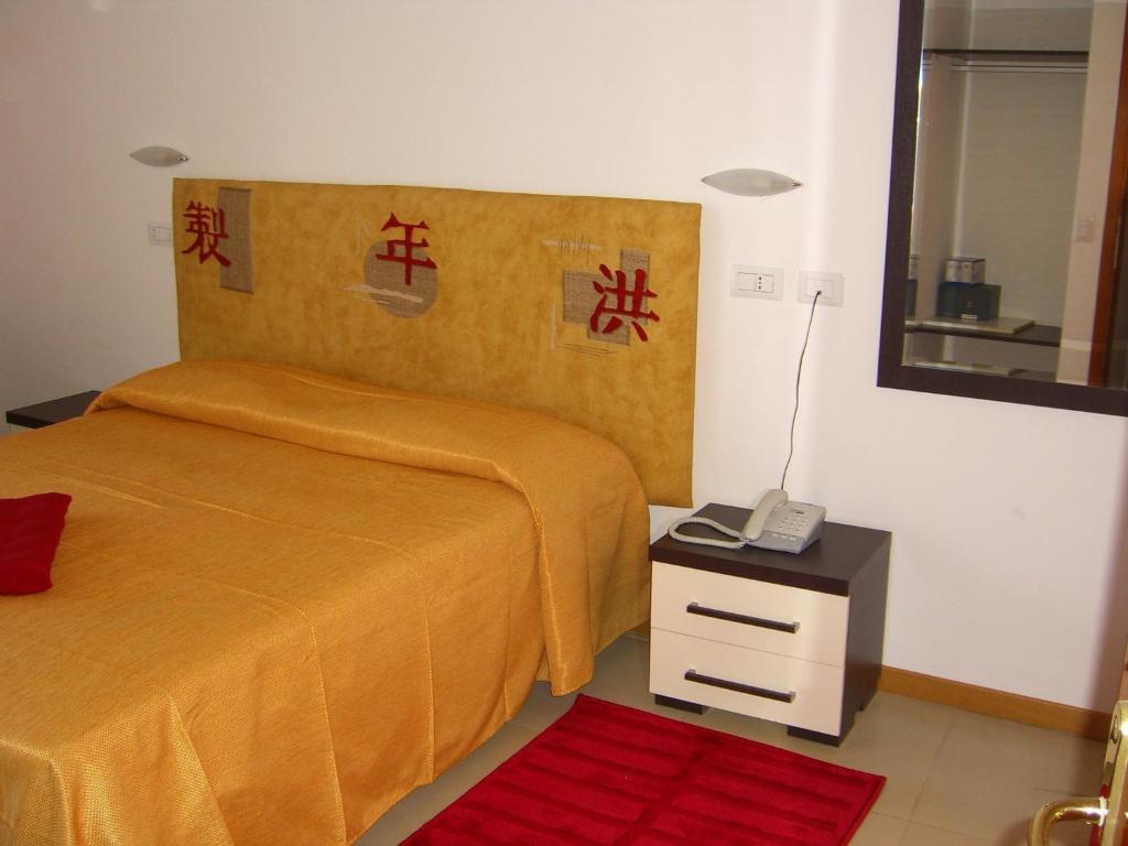 Postel nebo postele na pokoji v ubytování Hotel Flaminio