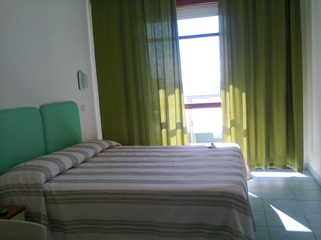 Postel nebo postele na pokoji v ubytování Hotel Flaminio