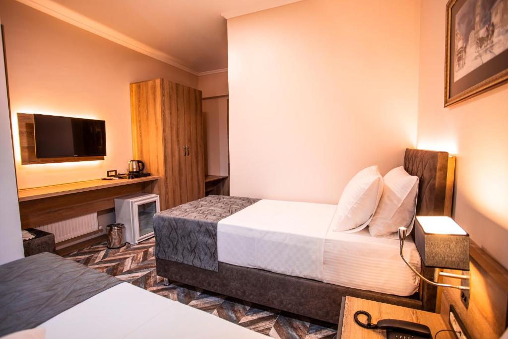 Postel nebo postele na pokoji v ubytování Hotel Kale 17