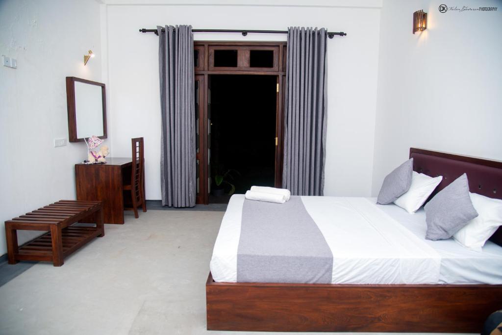 Ένα ή περισσότερα κρεβάτια σε δωμάτιο στο Sunliya Resort