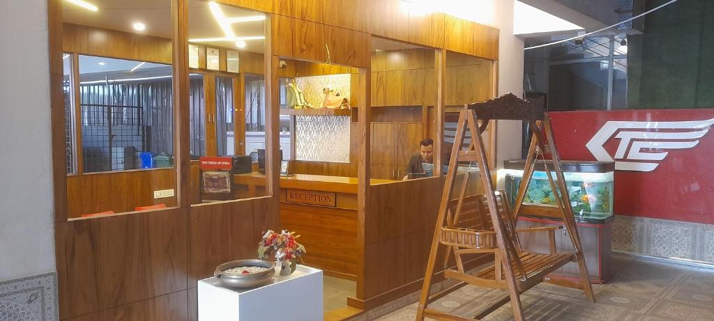 a room with a wooden wall with a ladder at CTC GARDENIA RESIDENCY in Bangalore