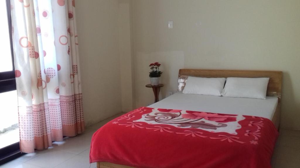 Postel nebo postele na pokoji v ubytování Tic Guest House