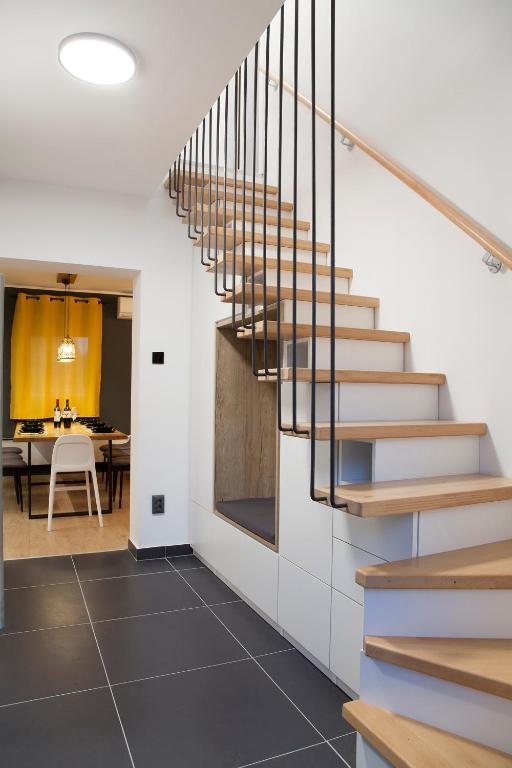 a staircase in a house with a dining room at Guesthouse Maya**** in Tuheljske Toplice