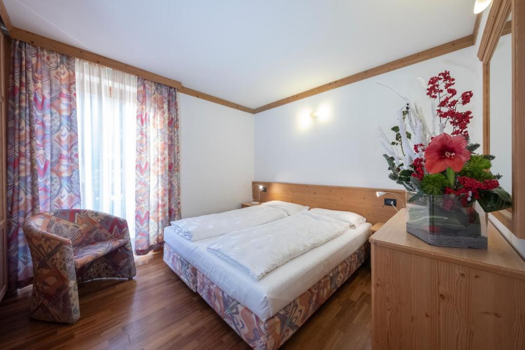 Postel nebo postele na pokoji v ubytování Residence Lagorai - Fiemme Holidays