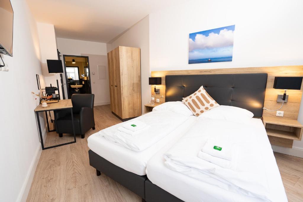 Postel nebo postele na pokoji v ubytování Homaris Strandhaus Blankenese