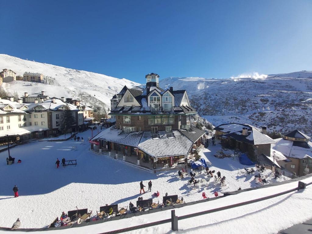 an aerial view of a ski lodge in the snow at Plaza Andalucía Edificio Dornajo 2-4 pax in Monachil