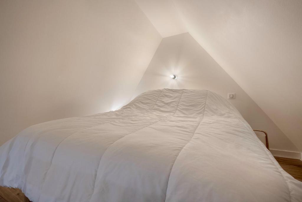 Katil atau katil-katil dalam bilik di Charmant appartement en plein centre du Pouliguen!