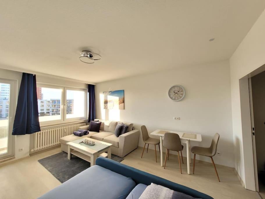 a living room with a couch and a table at Ferienwohnung Seestern Geeste in Bremerhaven