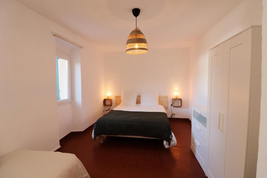 Posteľ alebo postele v izbe v ubytovaní Appartements à la ferme
