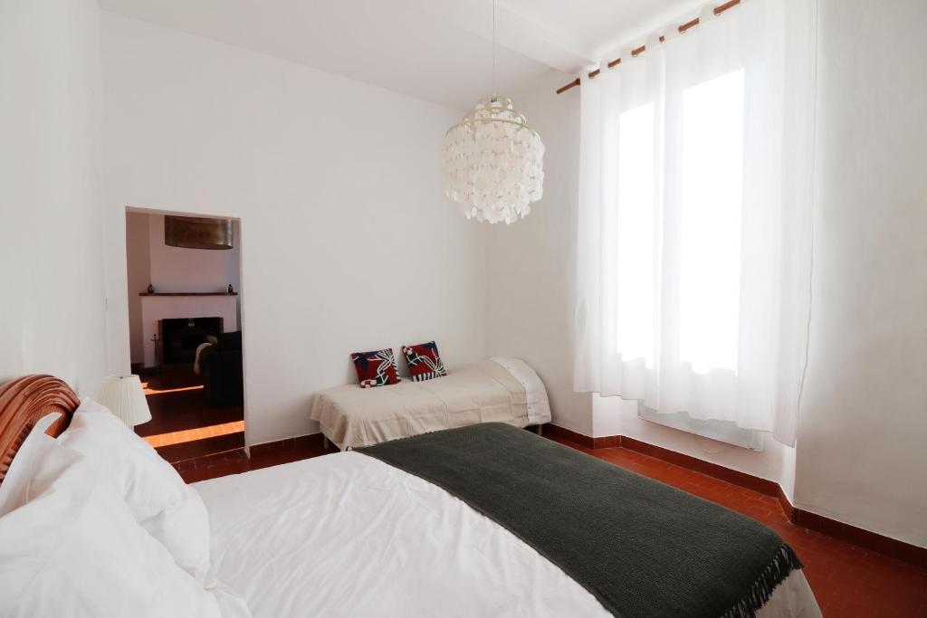 Posteľ alebo postele v izbe v ubytovaní Appartements à la ferme