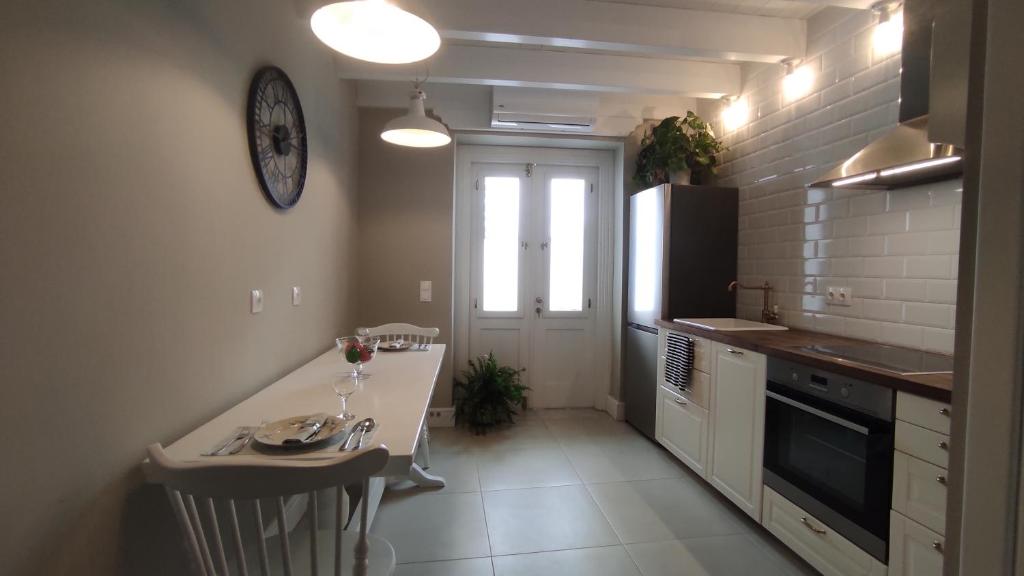 a small kitchen with a counter and a window at Marietta's House in Rhodes Town