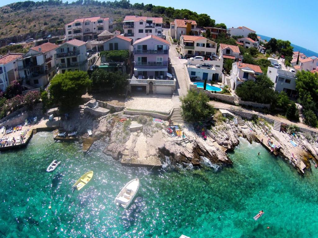 an aerial view of a resort with boats in the water at Apartments Atlas Grubišić in Primošten