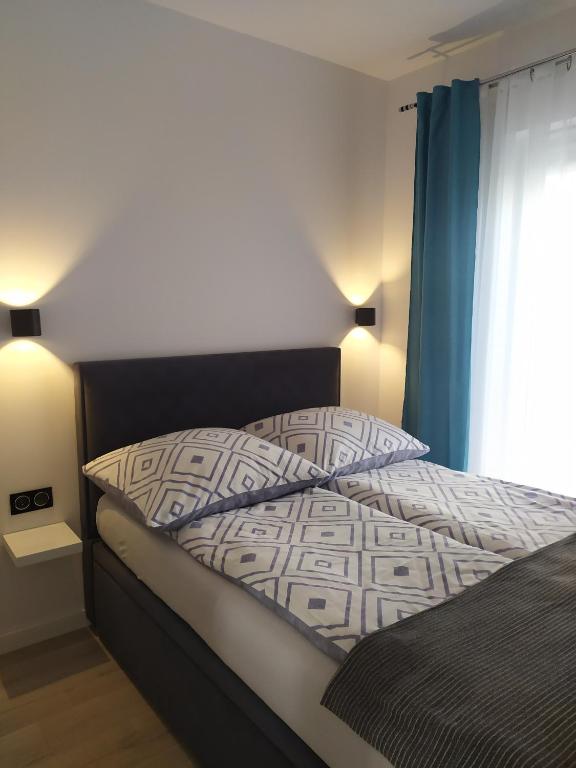 Posteľ alebo postele v izbe v ubytovaní Apartament Lenka