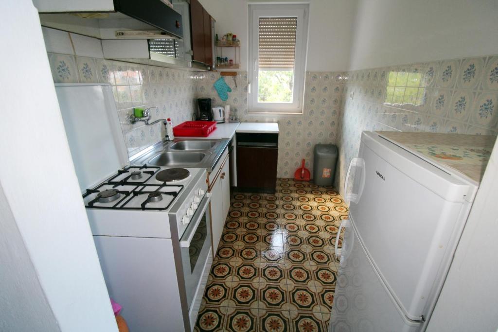 Kuchyň nebo kuchyňský kout v ubytování Apartman Moro