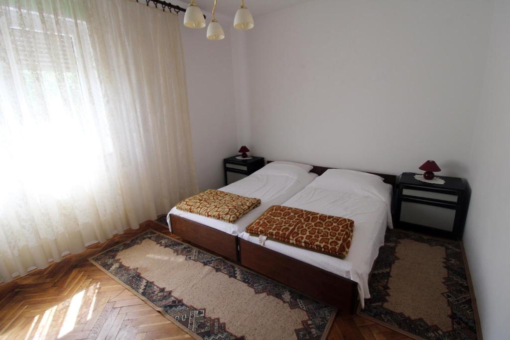 Postel nebo postele na pokoji v ubytování Apartman Moro