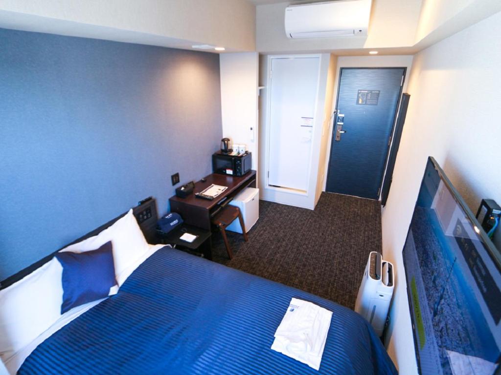 TV a/nebo společenská místnost v ubytování HOTEL LiVEMAX Akasaka
